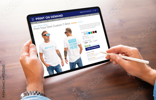 Canvas Print Man creating custom design t-shirt on print on demand service website
