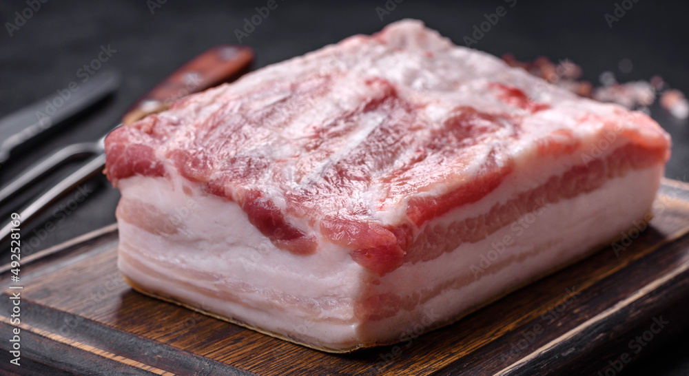 Close-up fat Salted lard homemade lard on a wooden board Close-up fat Salted lard homemade lard on a wooden board