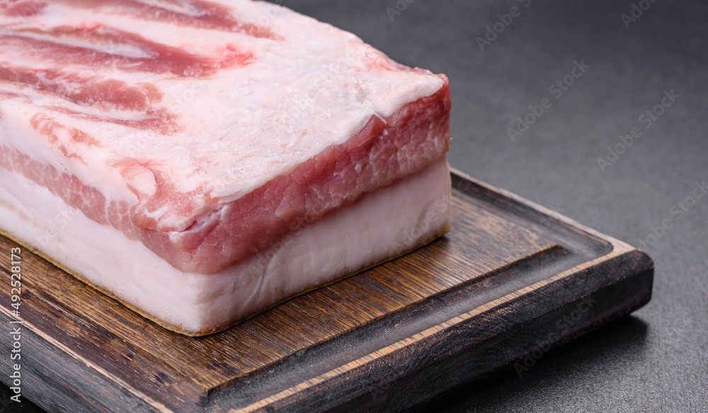 Close-up fat Salted lard homemade lard on a wooden board Close-up fat Salted lard homemade lard on a wooden board