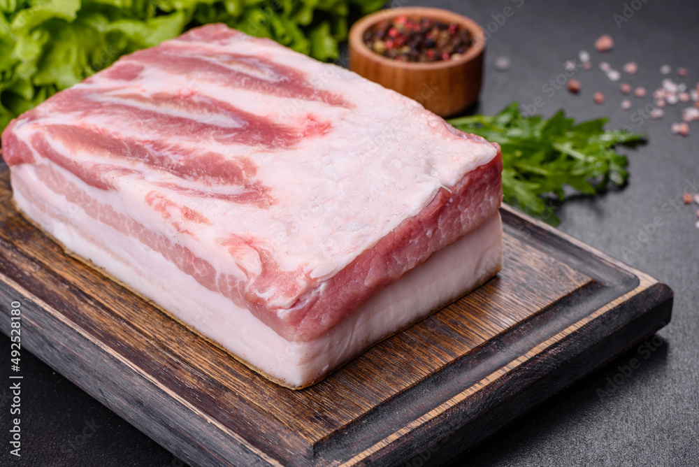 Close-up fat Salted lard homemade lard on a wooden board Close-up fat Salted lard homemade lard on a wooden board
