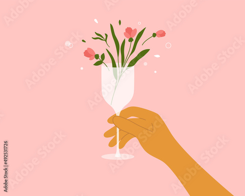 Human hand holding champagne or wine glass with blooming flower, leaves. Rose or pion in drink. Hello spring abstract illustration. Cocktail, fresh beverage, juice, summer party, vector floral poster