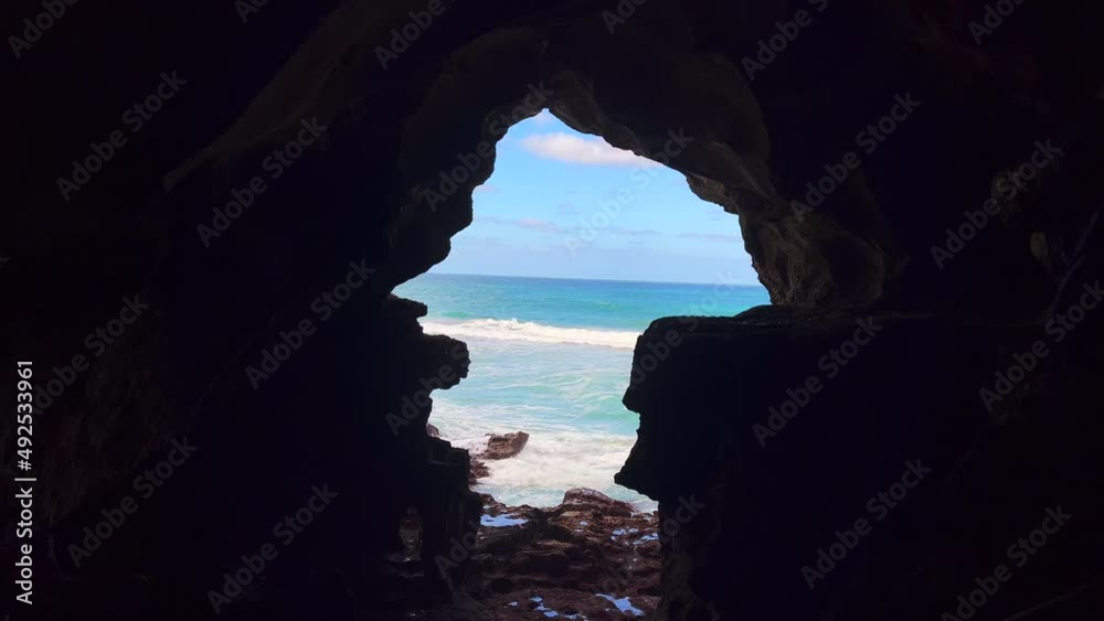Sea view from the inside of a dark cave