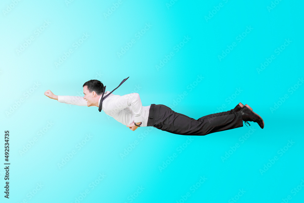 Fototapeta premium Male entrepreneur flying with a superhero pose