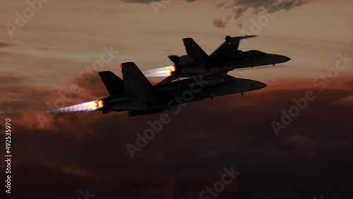 4K Aerial two F18 Hornet flying at sunset and rolling left