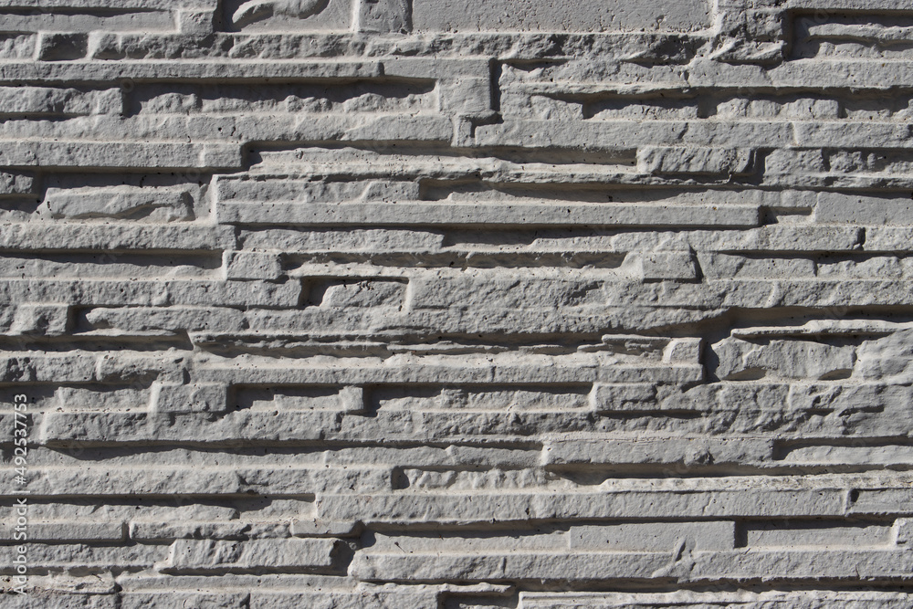 White narrow stone wall background texture White narrow stone wall background texture