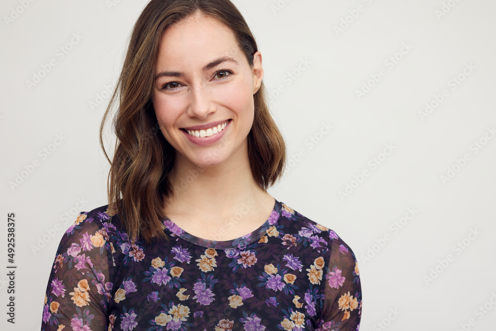 Portrait of young smiling woman who is looking beautifully and confidently in camera, isolated on white. Portrait of young smiling woman who is looking beautifully and confidently in camera, isolated on white.
