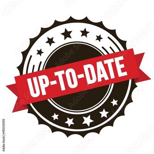 UP-TO-DATE text on red brown ribbon stamp.