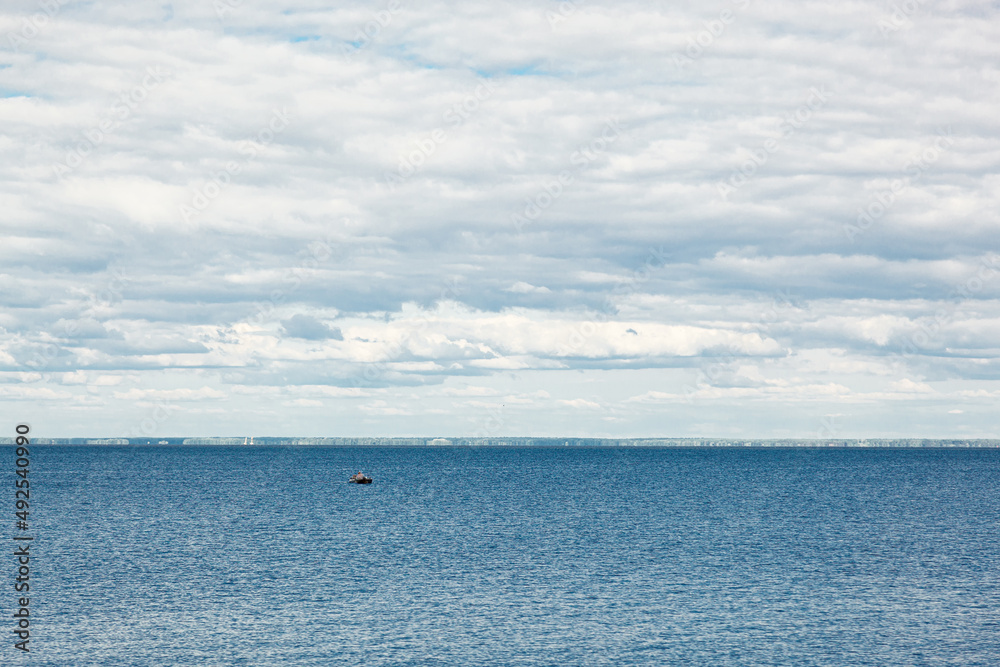 beautiful landscape of the sea against the background of a blue sky with clouds