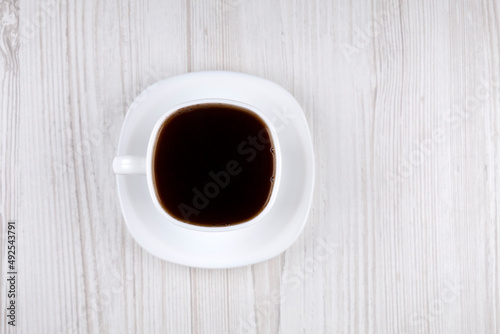 Coffee. White cup with coffee, top view