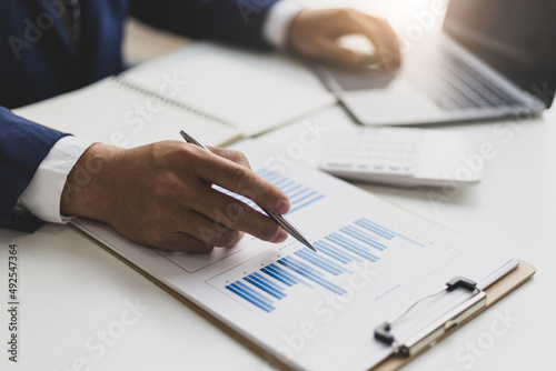 Accountant, businessman or banker points to financial reports and financial planning strategy analysis. Concept of financial advisor, auditing, banking and accounting.