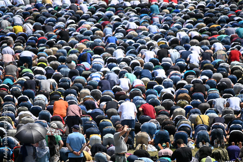 Muslim worshipers praying. Large crowd of Muslim people praying namaz. 