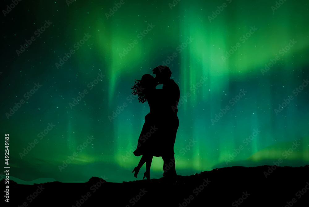 couple silhouettes kissing on background northern lights use for news advertisement flyer poster