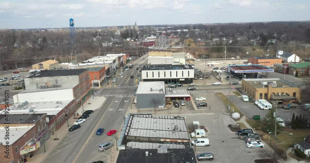 Grand Ledge, Michigan downtown skyline drone view moving sideways. Grand Ledge, Michigan downtown skyline drone view moving sideways.