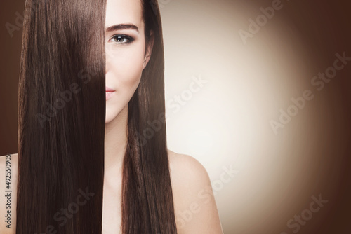 Beautiful young woman with straight long hair