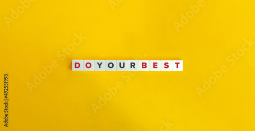 Do Your Best Phrase on Letter Tiles on Yellow Background. Minimal Aesthetics.