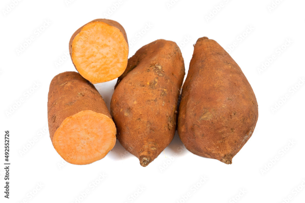 sweet potato whole and cut on a white background sweet potato whole and cut on a white background
