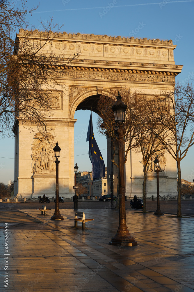 Arch of Triumph building from Paris, France, during a beautiful spring sunrise. Photo taken from Champs Elysee boulevard. Landmarks of France.