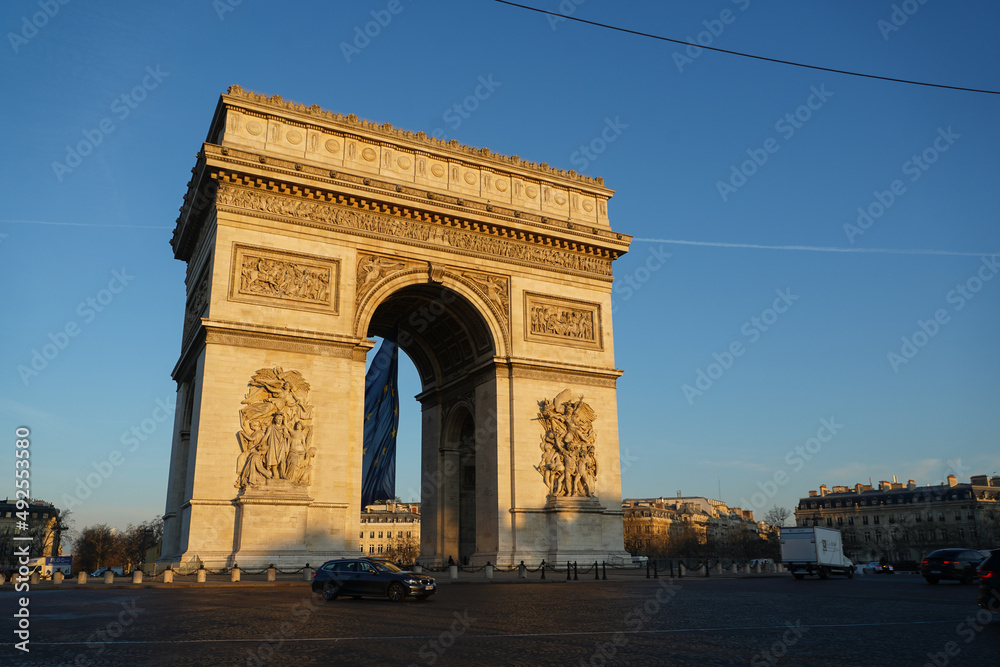 Arch of Triumph building from Paris, France, during a beautiful spring sunrise. Photo taken from Champs Elysee boulevard. Landmarks of France.