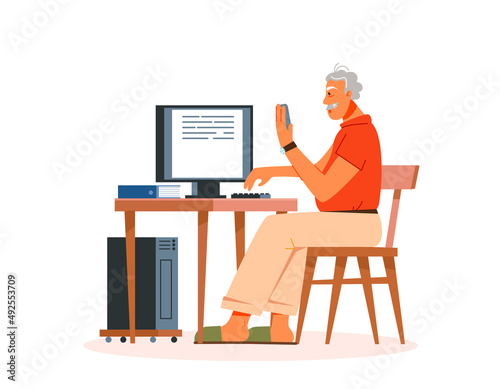 An elderly man works or studies on a computer. Technology and the elderly. Technology and the elderly.