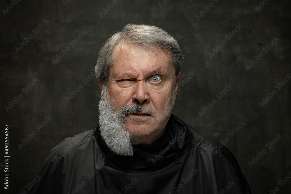 Obraz premium Collage made of portrait of serious grey-bearded senior man looking at camera isolated on dark vintage background. Fashion, beauty concept