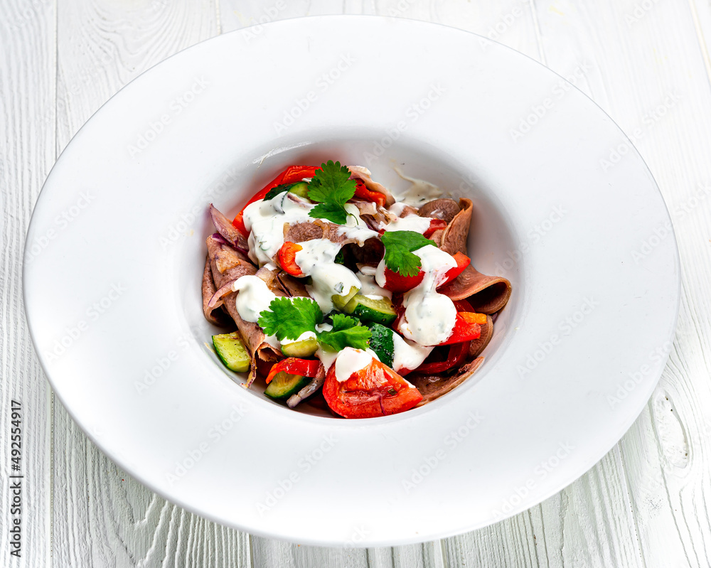 Beef tongue salad with fresh vegetables. Beef tongue salad with fresh vegetables.