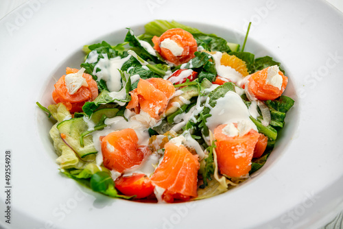 Salad with smoked salmon, fresh vegetables and cream cheese.