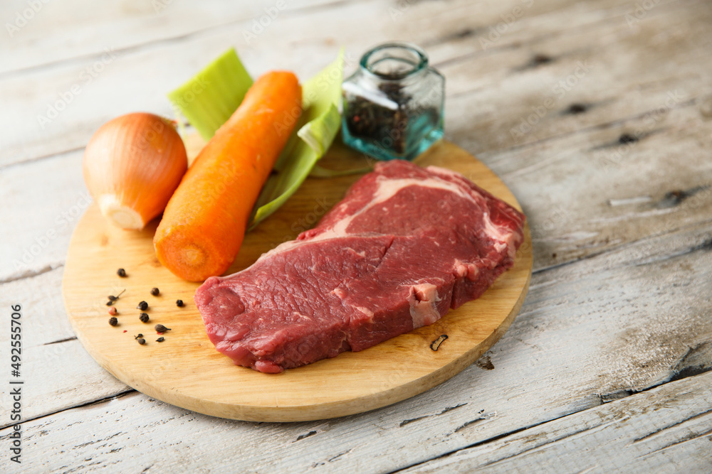 Beef broth ingredients on a wooden desk