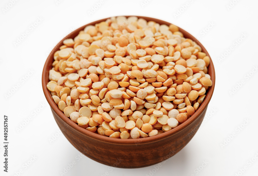 Pea groats in bowls and bags isolated on a white background. High quality photo Pea groats in bowls and bags isolated on a white background. High quality photo