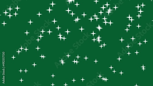 Green background with falling white star like crosses. Simple high definition animation with objects falling in a perfect, seamless loop. photo