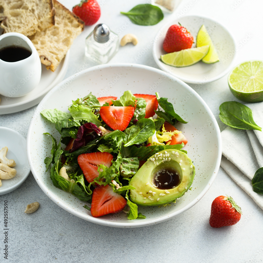 Healthy leaf salad with strawberry and avocado Healthy leaf salad with strawberry and avocado