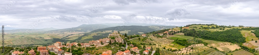 Super panoramic view of Tuscany hills with medieval town Castiglione d'Orcia. Italy