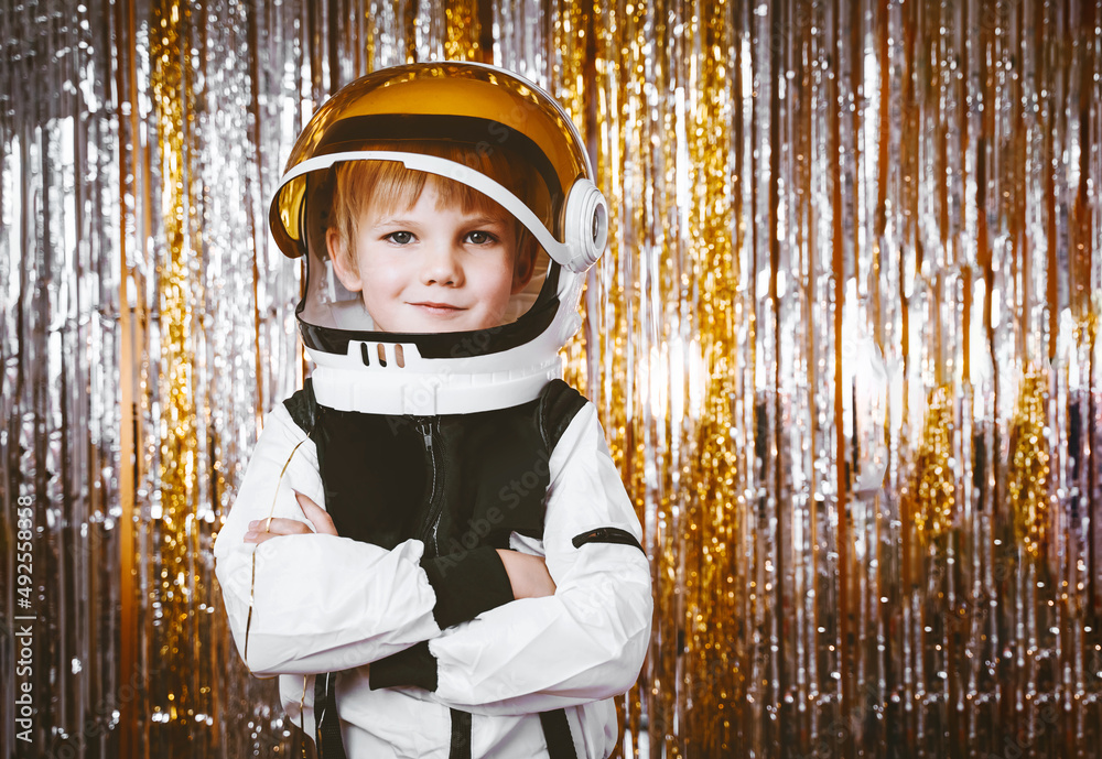 Child in fancy dress of astronaut pilot costume having fun at masquerade  party in festive background with foil curtain decorations. Kids birthday  party, Halloween, New Year, Celebration, Holiday. Stock Photo | Adobe