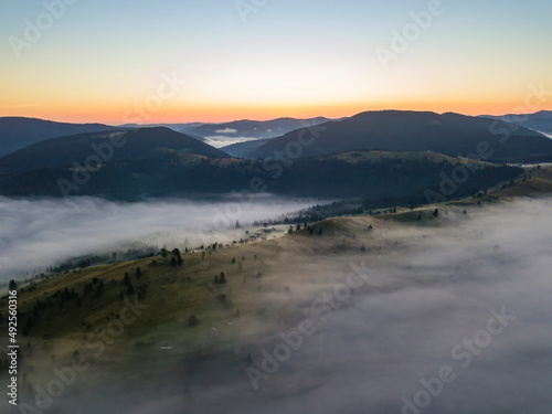 Morning fog in the Ukrainian Carpathians. Aerial drone view.