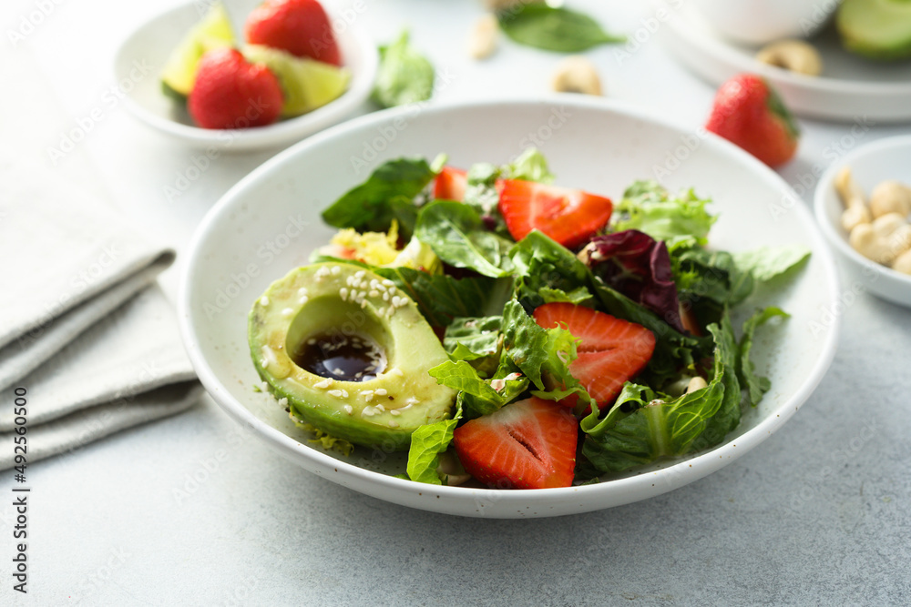Healthy leaf salad with strawberry and avocado Healthy leaf salad with strawberry and avocado