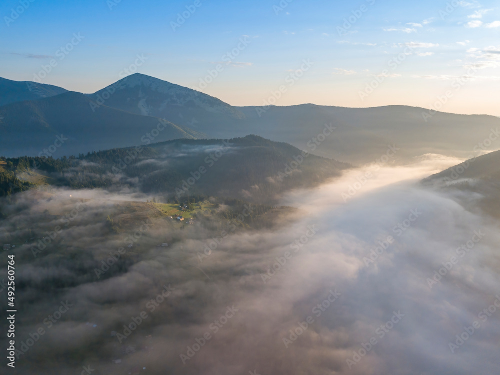 Morning fog in the Ukrainian Carpathians. Aerial drone view. Morning fog in the Ukrainian Carpathians. Aerial drone view.