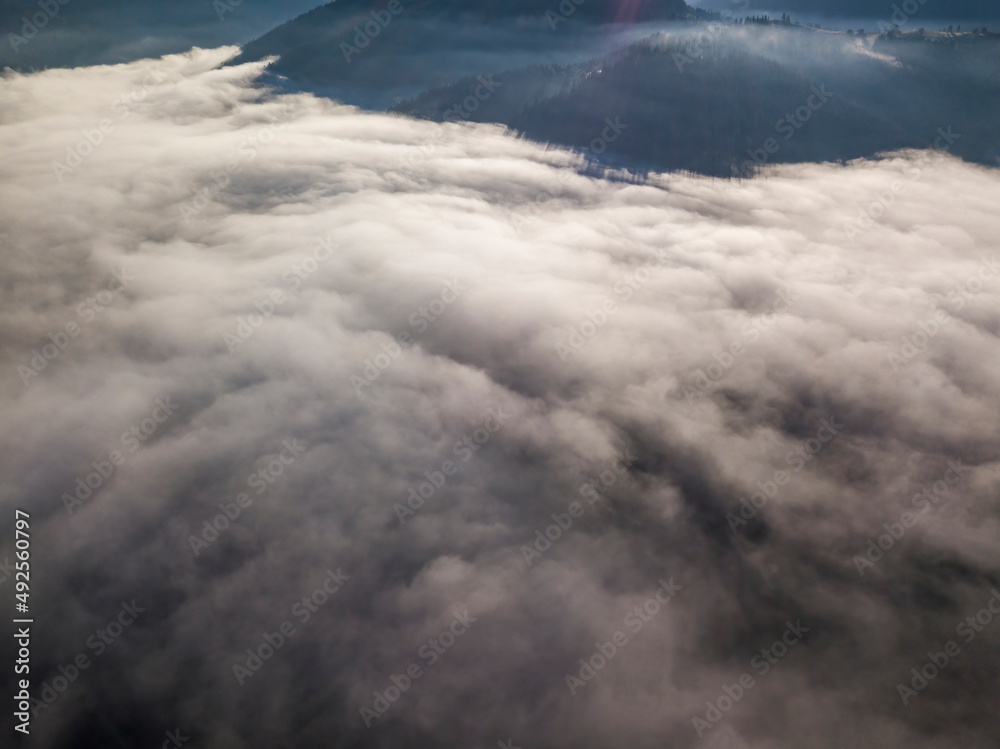 Obraz premium Morning mist in Ukrainian Carpathian mountains. Aerial drone view.