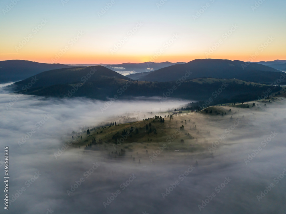 Morning fog in the Ukrainian Carpathians. Aerial drone view.