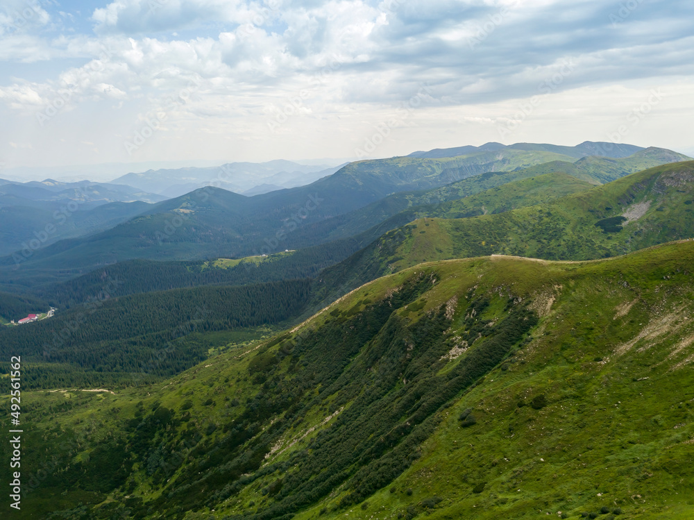 High mountains of the Ukrainian Carpathians in cloudy weather. Aerial drone view.
