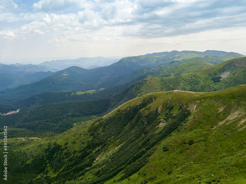 High mountains of the Ukrainian Carpathians in cloudy weather. Aerial drone view. High mountains of the Ukrainian Carpathians in cloudy weather. Aerial drone view.