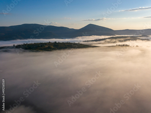 Morning fog in the Ukrainian Carpathians. Aerial drone view. © Sergey