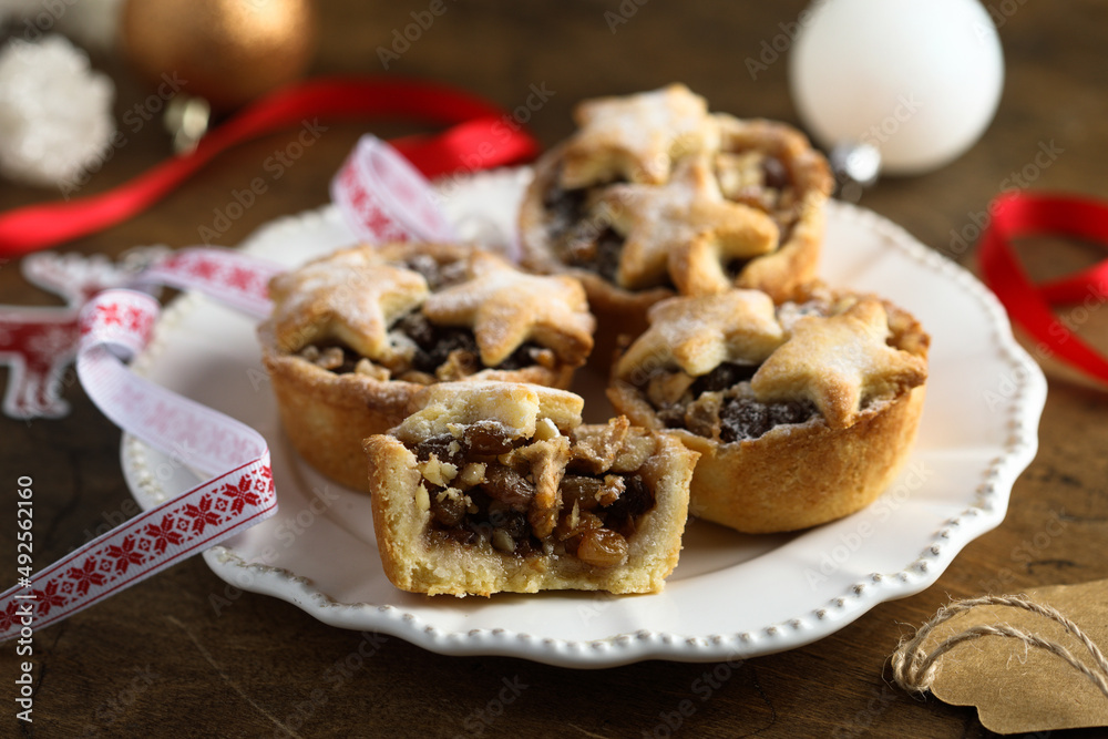 Traditional festive mince pies on a plate	
