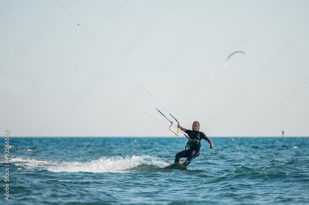 Woman kitesurfing on the ocean waters