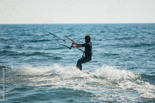 Woman kitesurfing on the ocean waters