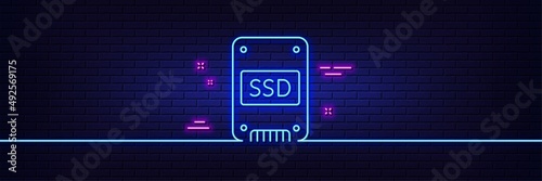 Neon light glow effect. SSD icon. Solid-state drive sign. Storage disk symbol. 3d line neon glow icon. Brick wall banner. SSD outline. Vector