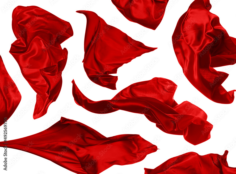 Set with beautiful delicate red silk floating on white background Set with beautiful delicate red silk floating on white background