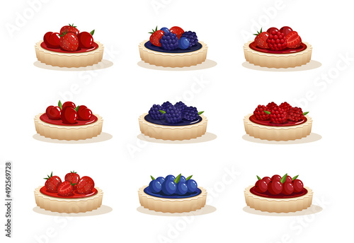 Set different tarts. Different tartlets with berries. Strawberries, raspberries, blackberries, blueberries, currants, cherry on cakes photo