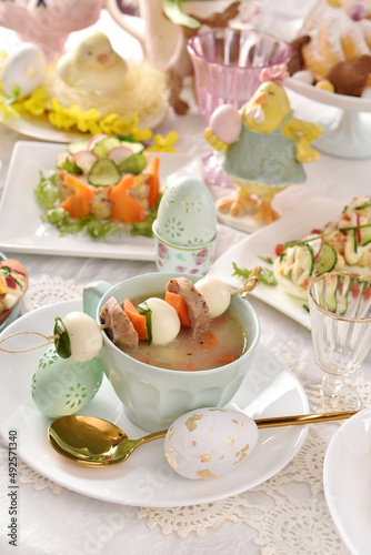 Easter white borscht with quail egg and sausage skewer