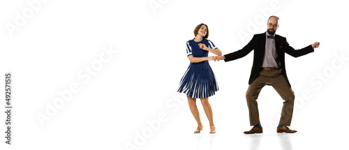 Flyer with couple of dancers, young man and woman in vintage retro style outfits dancing lindy hop dance isolated on white background. Timeless traditions, 60s, 70s fashion style.