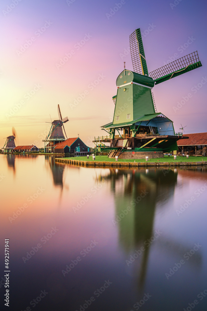 A couple of Dutch Windmills at sunset