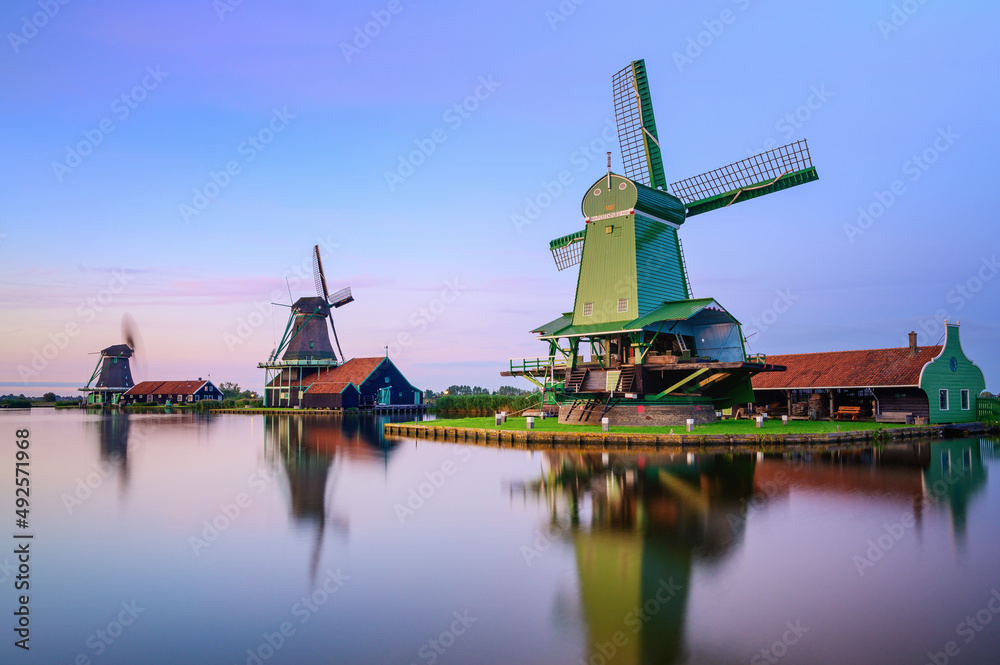A couple of Dutch Windmills at sunset
